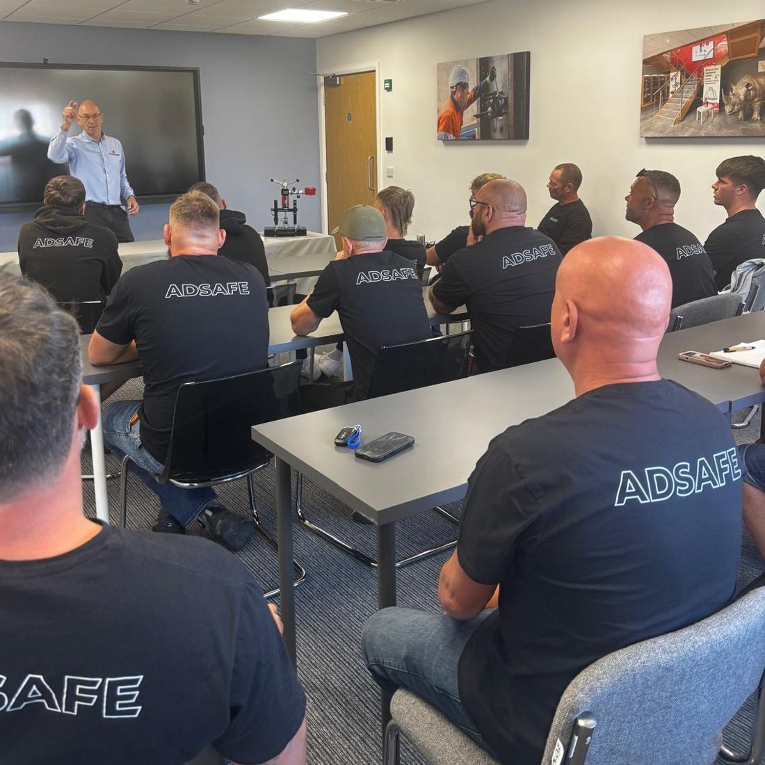AdSafe engineers in branded t-shirts on a digital testing training course